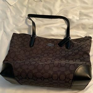 Coach purse with wallet and makeup bag.